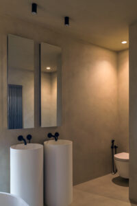 Microcement floor in modern bathroom